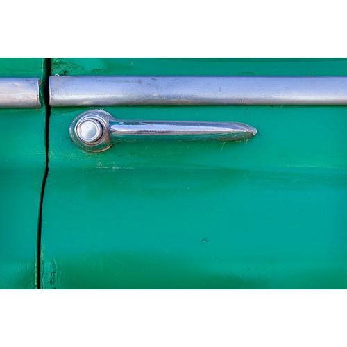 Detail of door handle on classic green car in Trinidad-Cuba